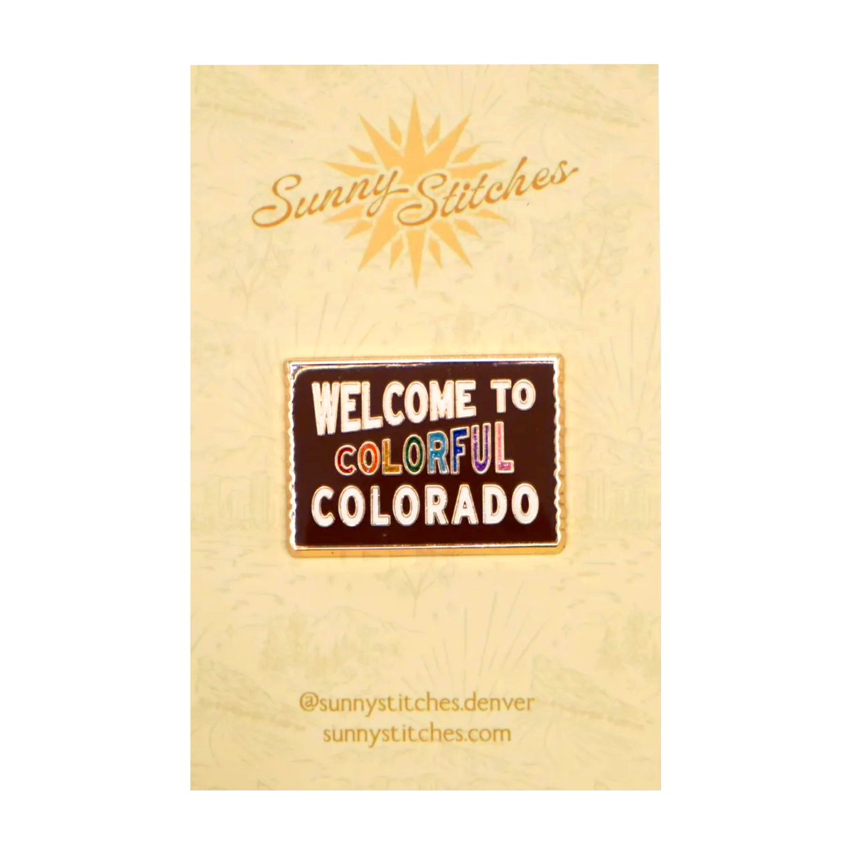 A 'Welcome to Colorful Colorado' needleminder by Sunny-Stitches, mounted on its original beige backing card featuring a sun graphic and brand name.