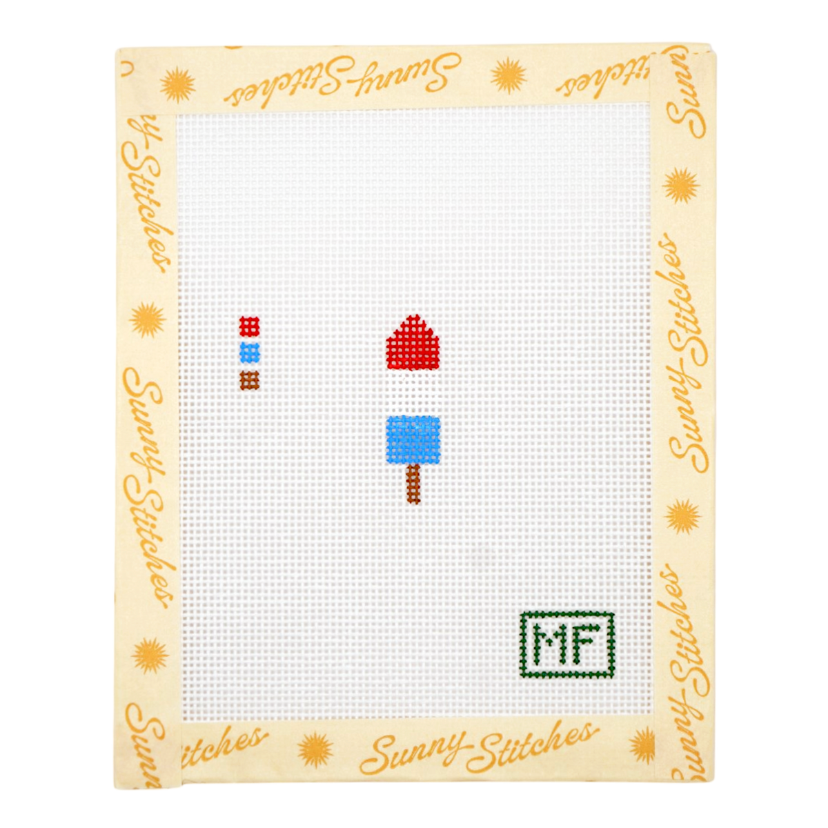 A framed cross-stitch canvas with a cream border printed with the brand name 'Sunny Stitches' and small sun motifs. The stitched design features three small colorful motifs on a white grid background, including a red and blue striped square, a red white and blue popsicle, and a green 'MF' monogram.