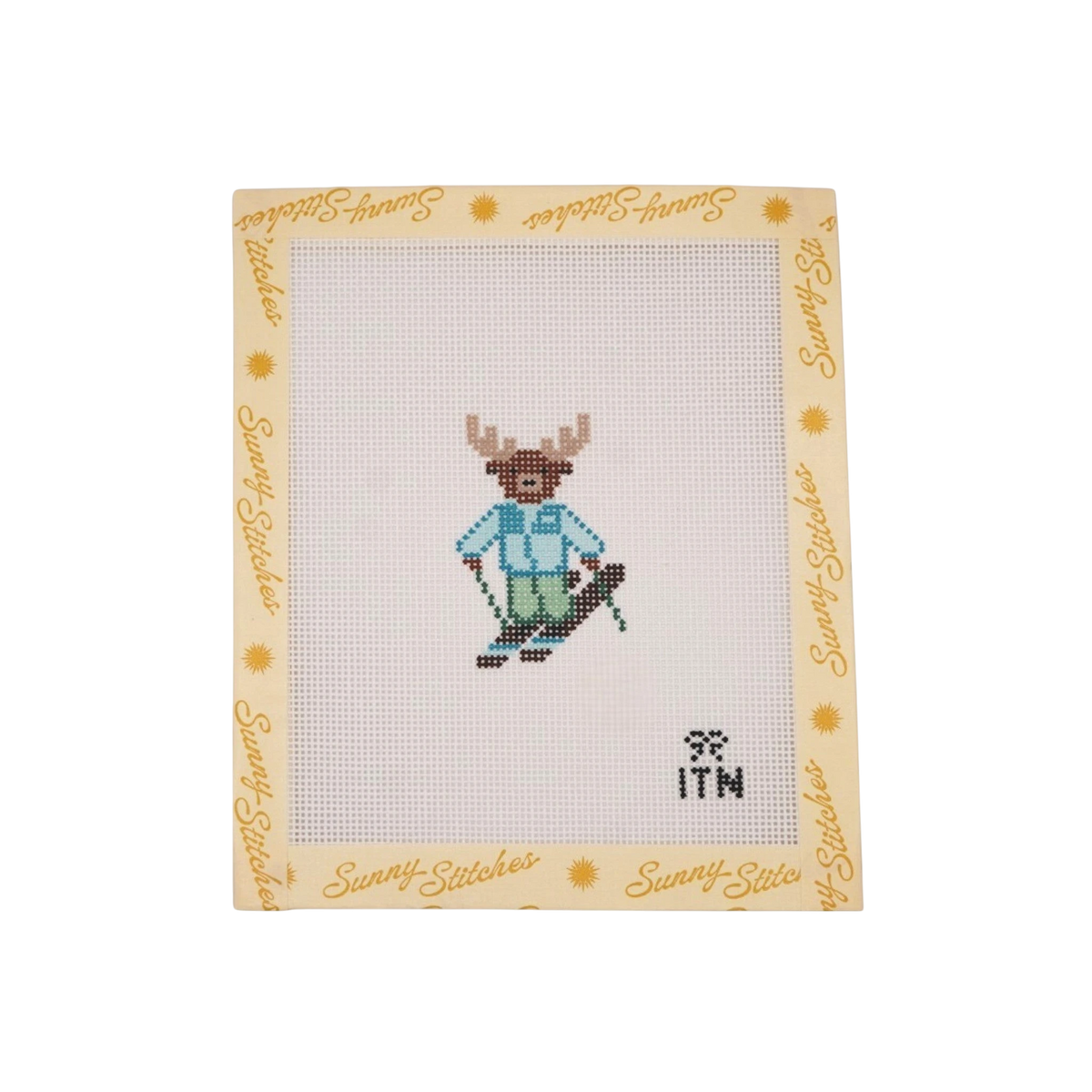Sunny Stitches Tiny Ski Moose needlepoint canvas featuring a brown moose wearing a blue jacket and green ski pants