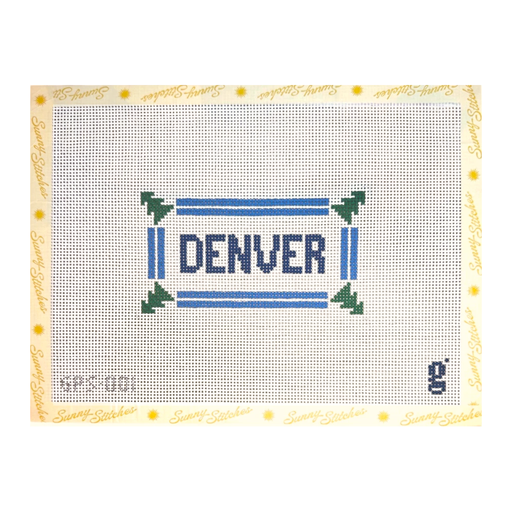 A needlepoint canvas featuring the word 'DENVER' in blue letters inside a blue and green border, with a cream border printed with 'Sunny Stitches' and small yellow sun motifs.