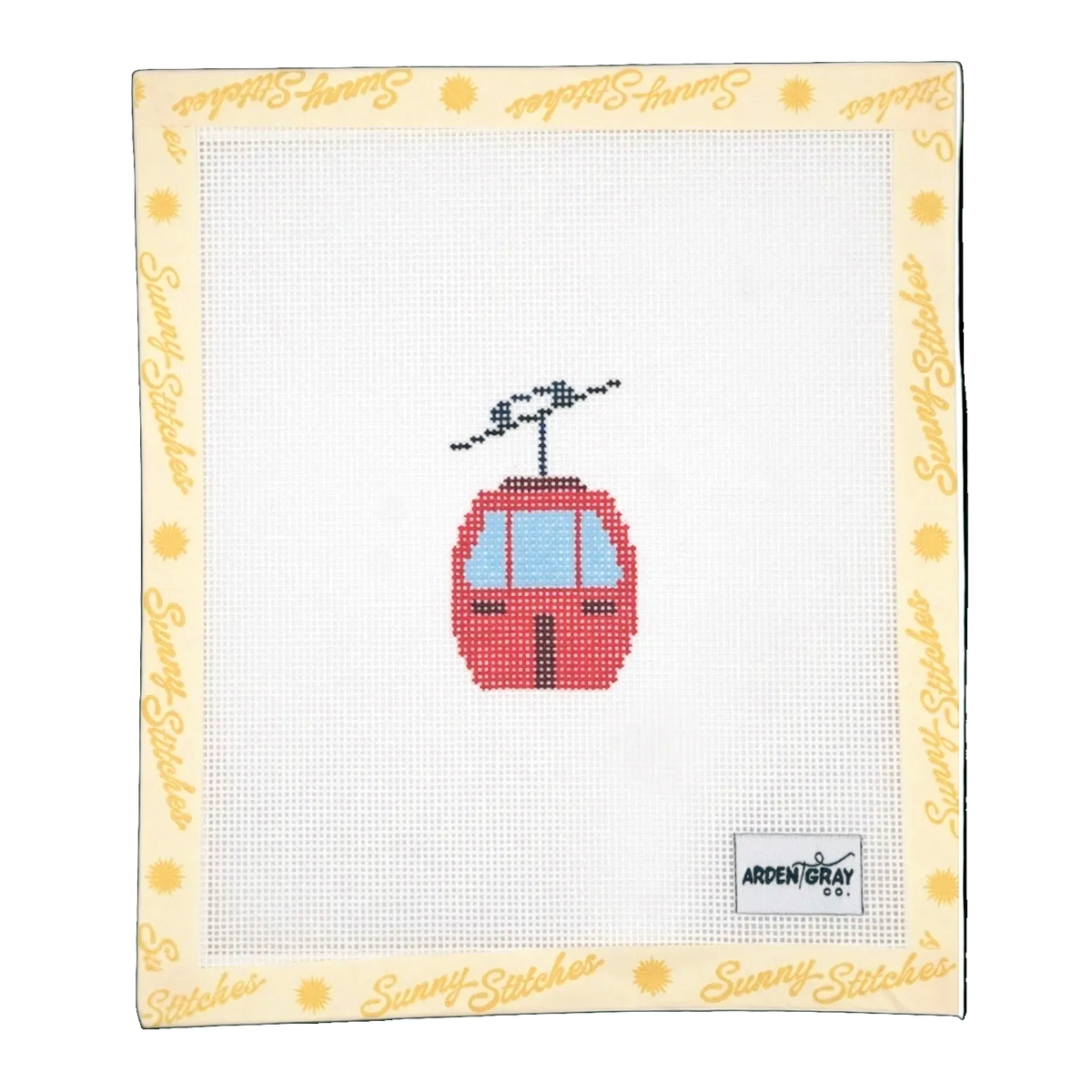 A counted needlepoint canvas featuring a red cable car / gondola with light blue windows, surrounded by a cream border printed with 'Sunny Stitches' in yellow script. The brand label 'Arden & Gray' is visible in the bottom right corner of the canvas.