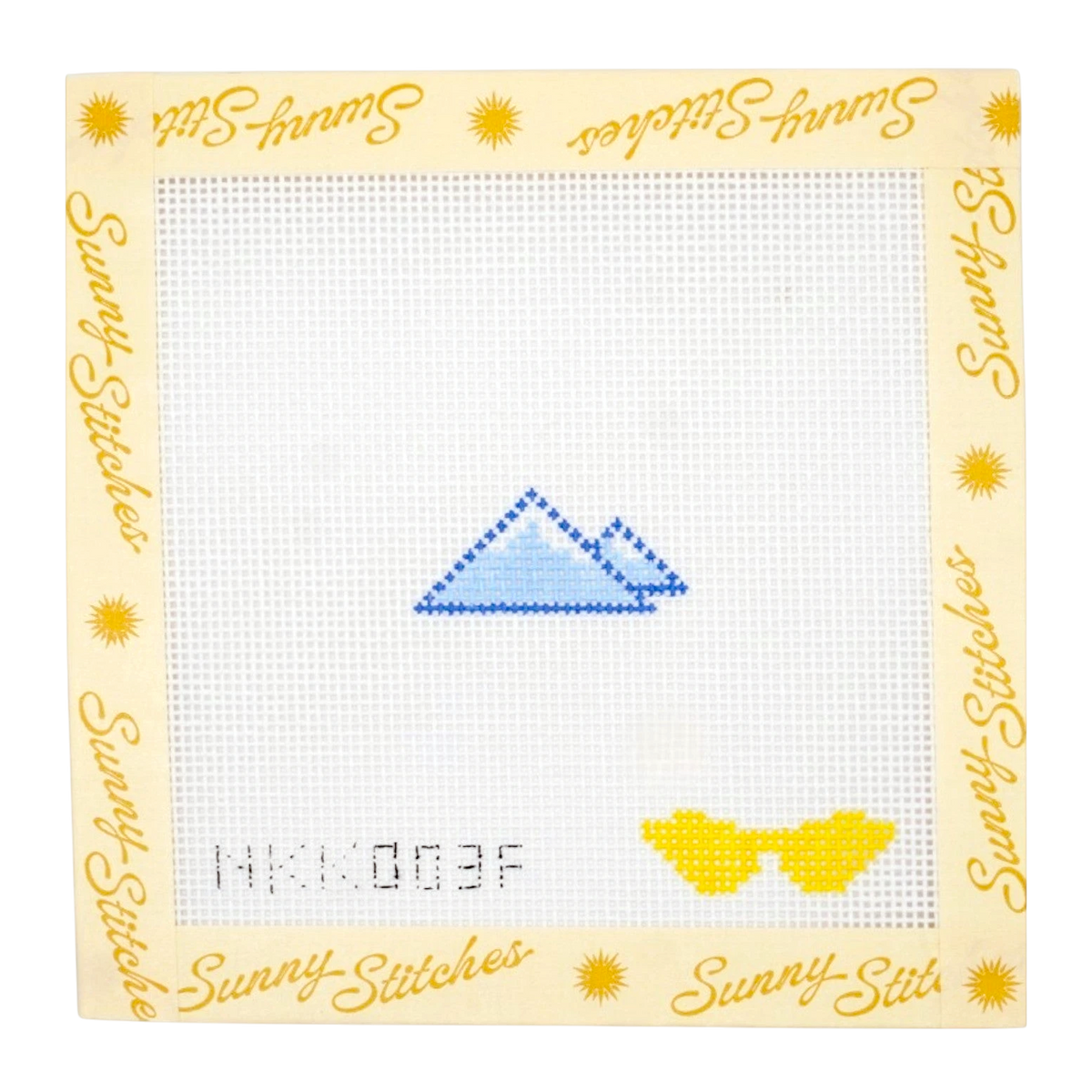 A square needlepoint canvas from Sunny Stitches featuring a blue mountain motif and yellow sunglasses on a white grid, surrounded by a decorative cream border with yellow text and sun icons.