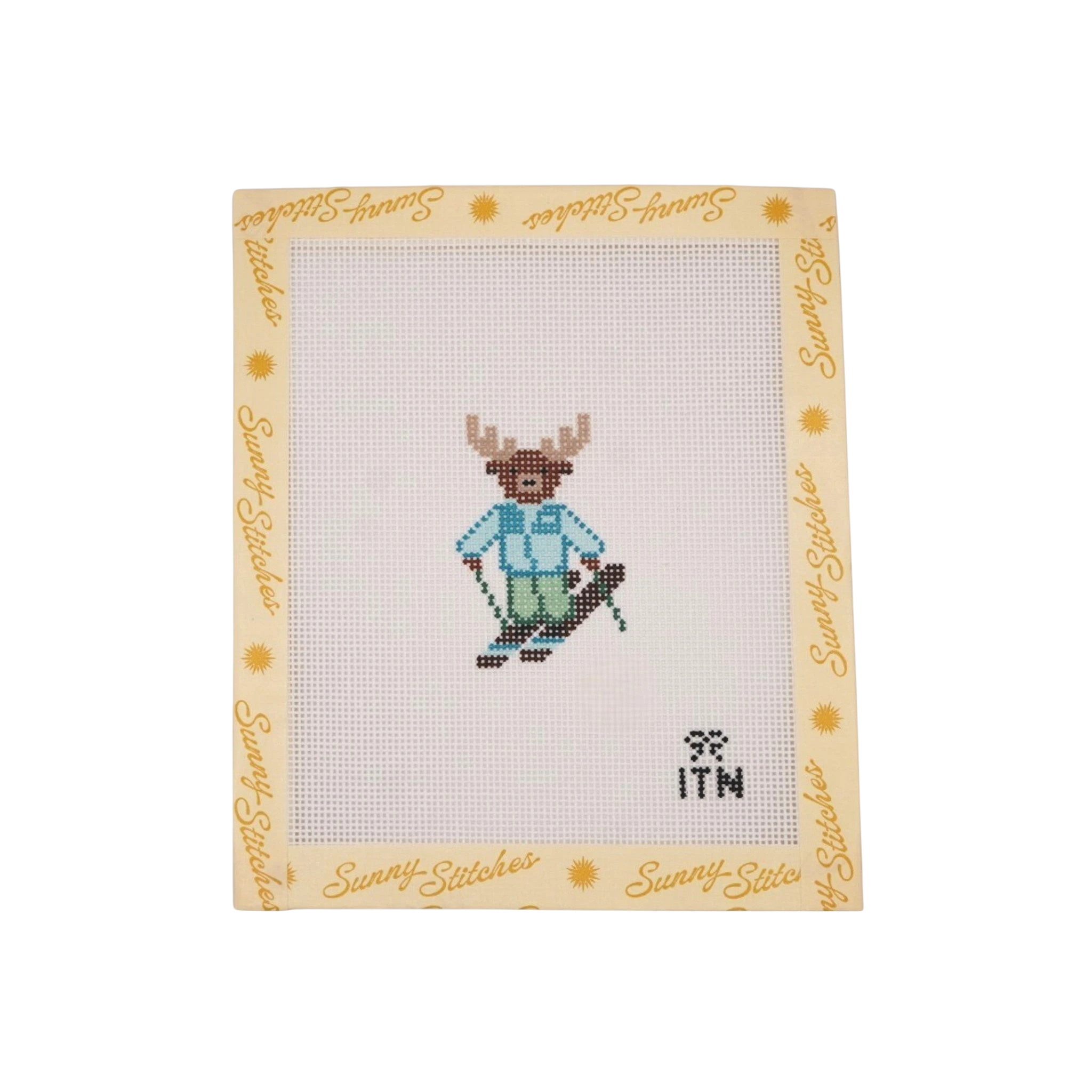Sunny Stitches Tiny Ski Moose needlepoint canvas featuring a brown moose wearing a blue jacket and green ski pants